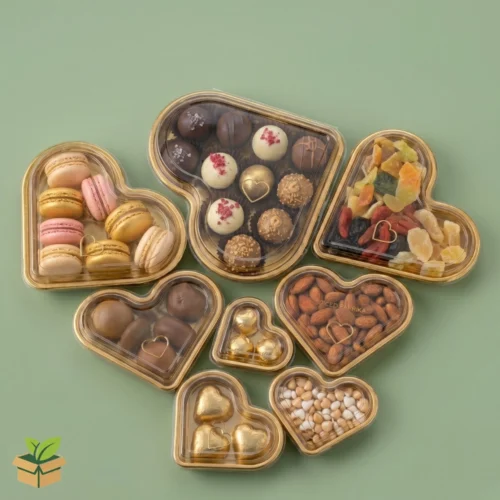 Heart shape chocolate box with transparent lid and gold base premium packaging